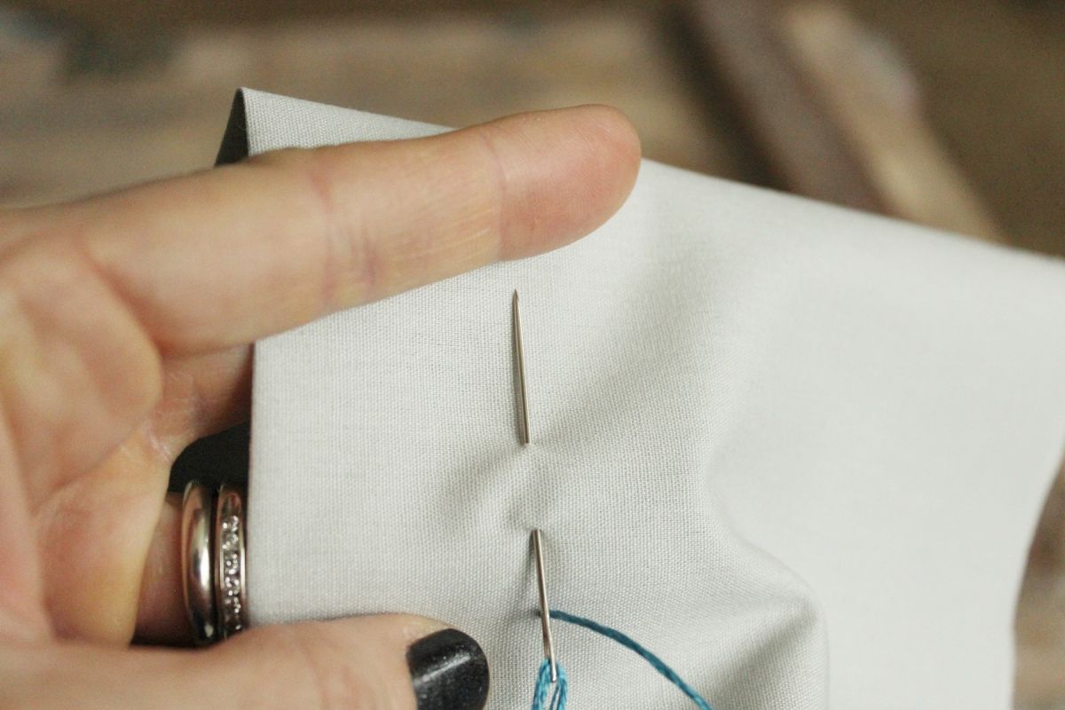 How to Sew - Press the tip of the needle down